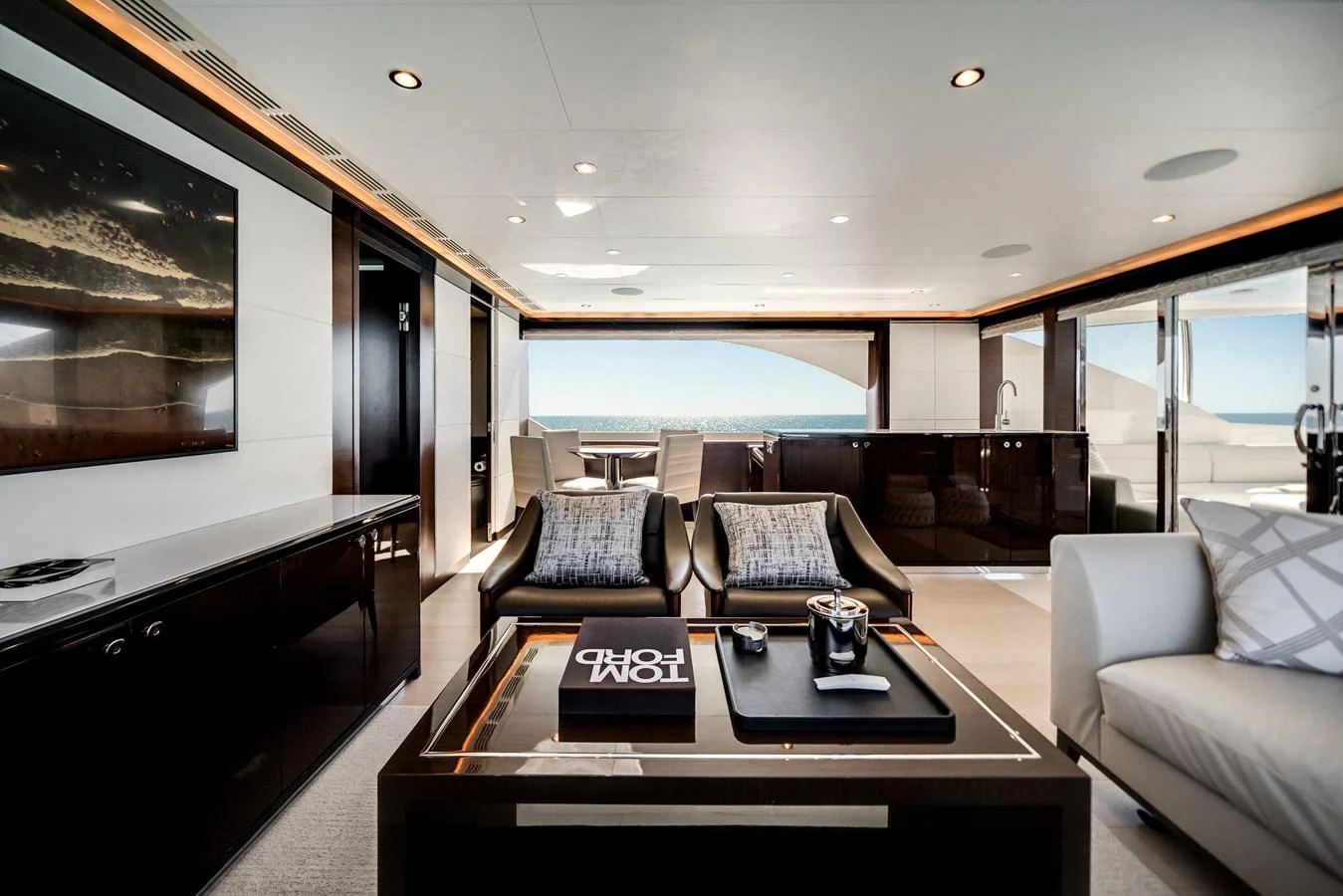 The salon offers a luxurious and spacious area with modern furnishings and a stunning view of the sea. aboard OCEAN ALEXANDER 37L/01 Yacht for Sale