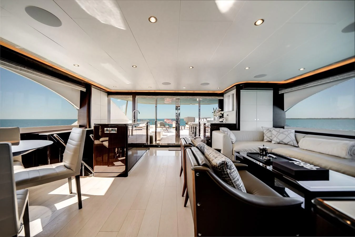 The yacht's salon offers a spacious and luxurious seating area with panoramic views of the sea. aboard OCEAN ALEXANDER 37L/01 Yacht for Sale
