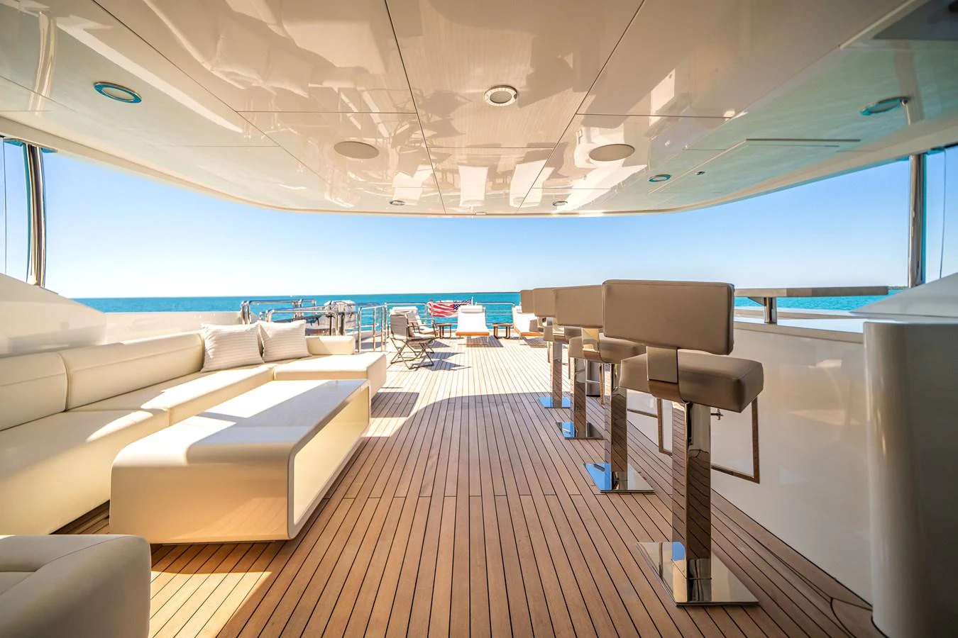 The aft deck offers a spacious and luxurious outdoor seating area with stunning ocean views. aboard OCEAN ALEXANDER 37L/01 Yacht for Sale