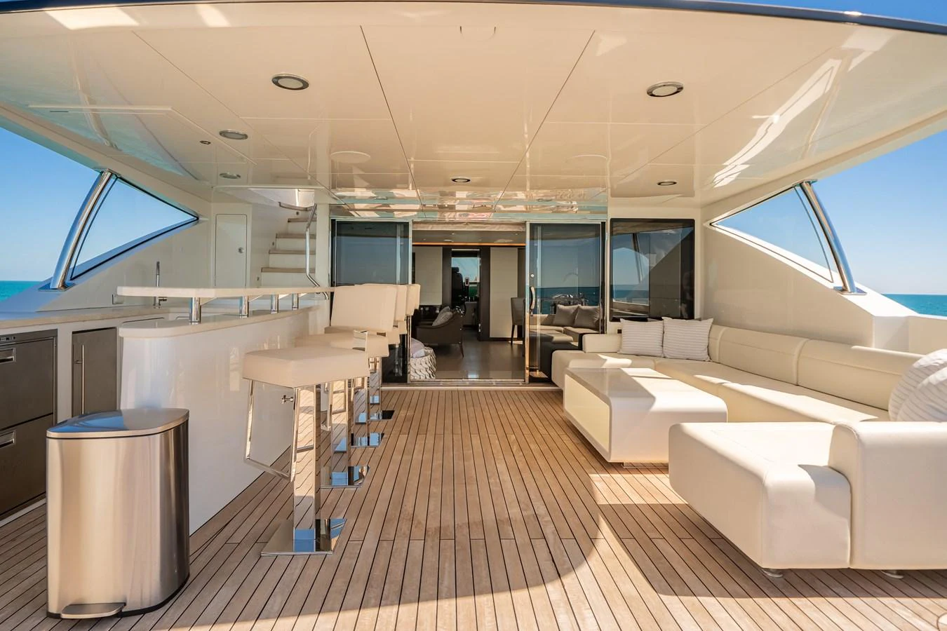 Spacious aft deck with comfortable seating and a sleek bar area. aboard OCEAN ALEXANDER 37L/01 Yacht for Sale