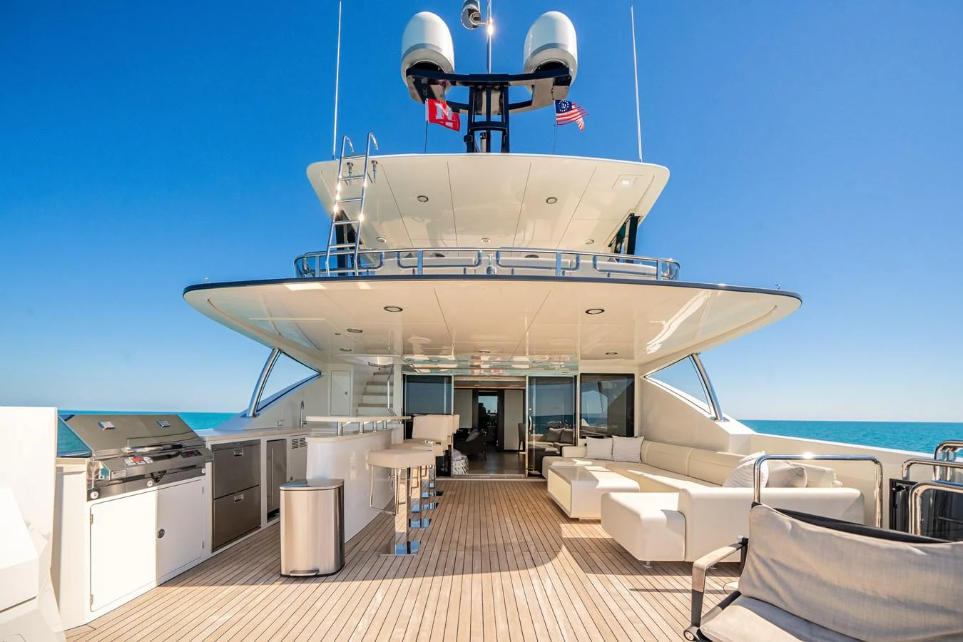 The spacious aft deck features luxurious seating and a well-equipped outdoor kitchen, perfect for entertaining. aboard OCEAN ALEXANDER 37L/01 Yacht for Sale