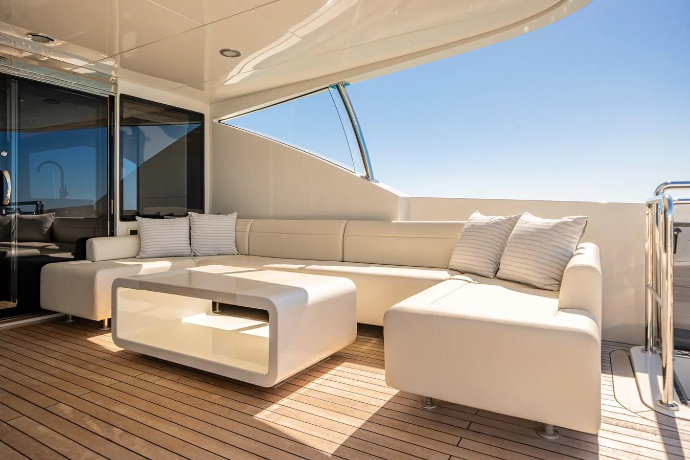 The aft deck features a stylish and comfortable seating area with modern furnishings and a serene ambiance. aboard OCEAN ALEXANDER 37L/01 Yacht for Sale