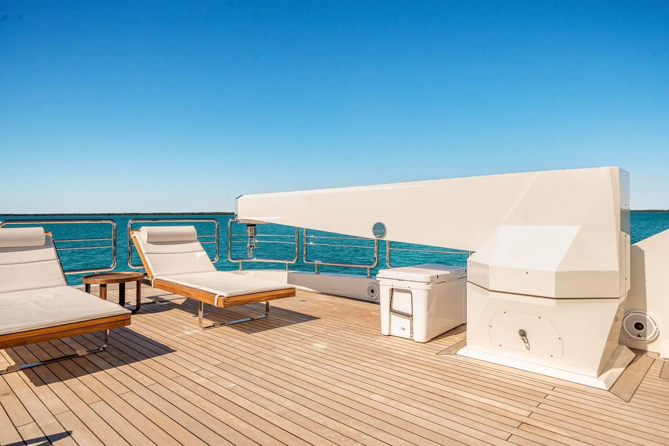 The sundeck offers a serene space with sun loungers and a clear view of the sea. aboard OCEAN ALEXANDER 37L/01 Yacht for Sale