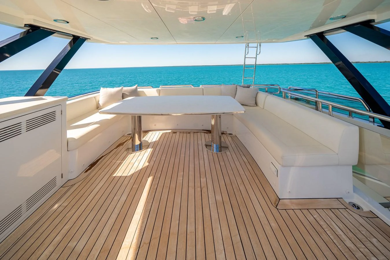The aft deck features a spacious seating area with a large table, perfect for alfresco dining while enjoying the ocean view. aboard OCEAN ALEXANDER 37L/01 Yacht for Sale
