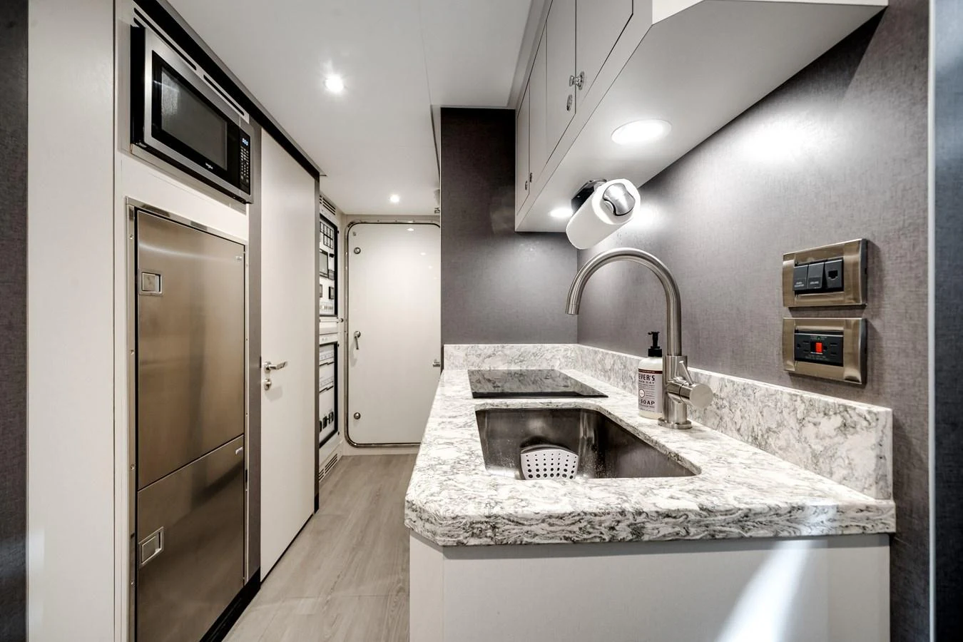 The yacht's galley features modern appliances and a sleek, functional design. aboard OCEAN ALEXANDER 37L/01 Yacht for Sale
