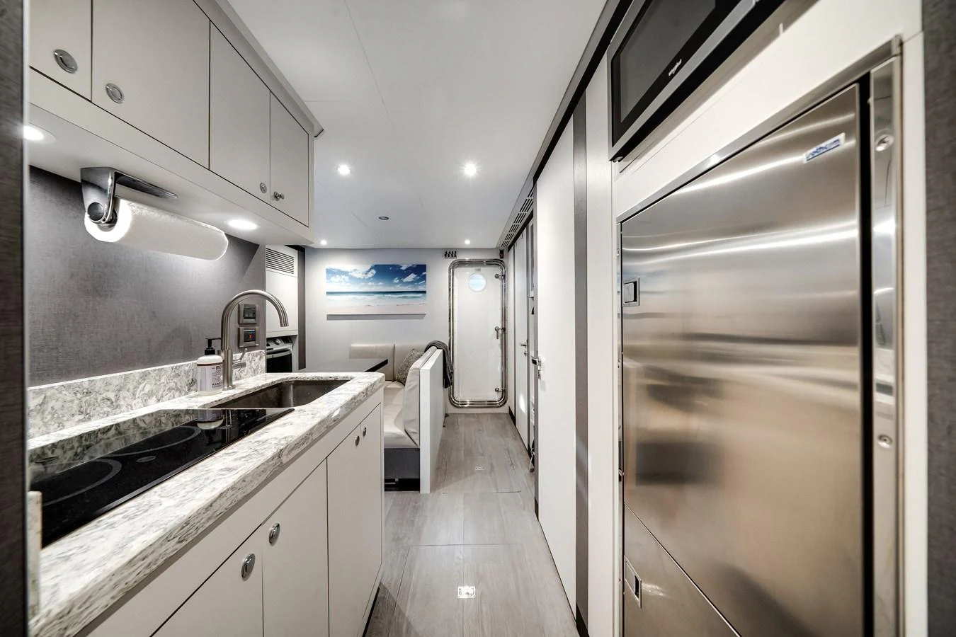 A modern galley with sleek appliances and ample counter space. aboard OCEAN ALEXANDER 37L/01 Yacht for Sale