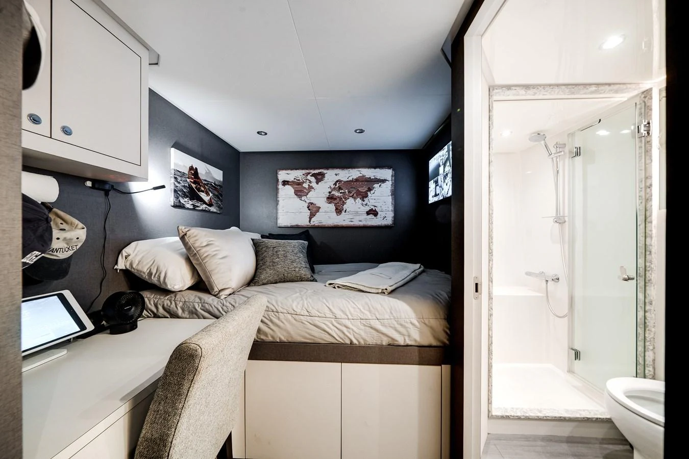 A cozy and well-appointed cabin featuring a comfortable bed and modern amenities. aboard OCEAN ALEXANDER 37L/01 Yacht for Sale