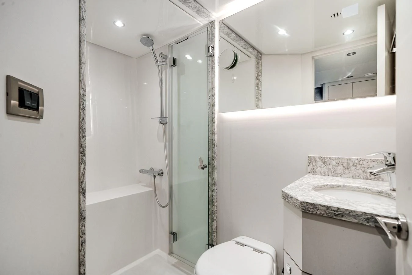 The yacht's bathroom features a modern shower, sleek fixtures, and elegant finishes. aboard OCEAN ALEXANDER 37L/01 Yacht for Sale
