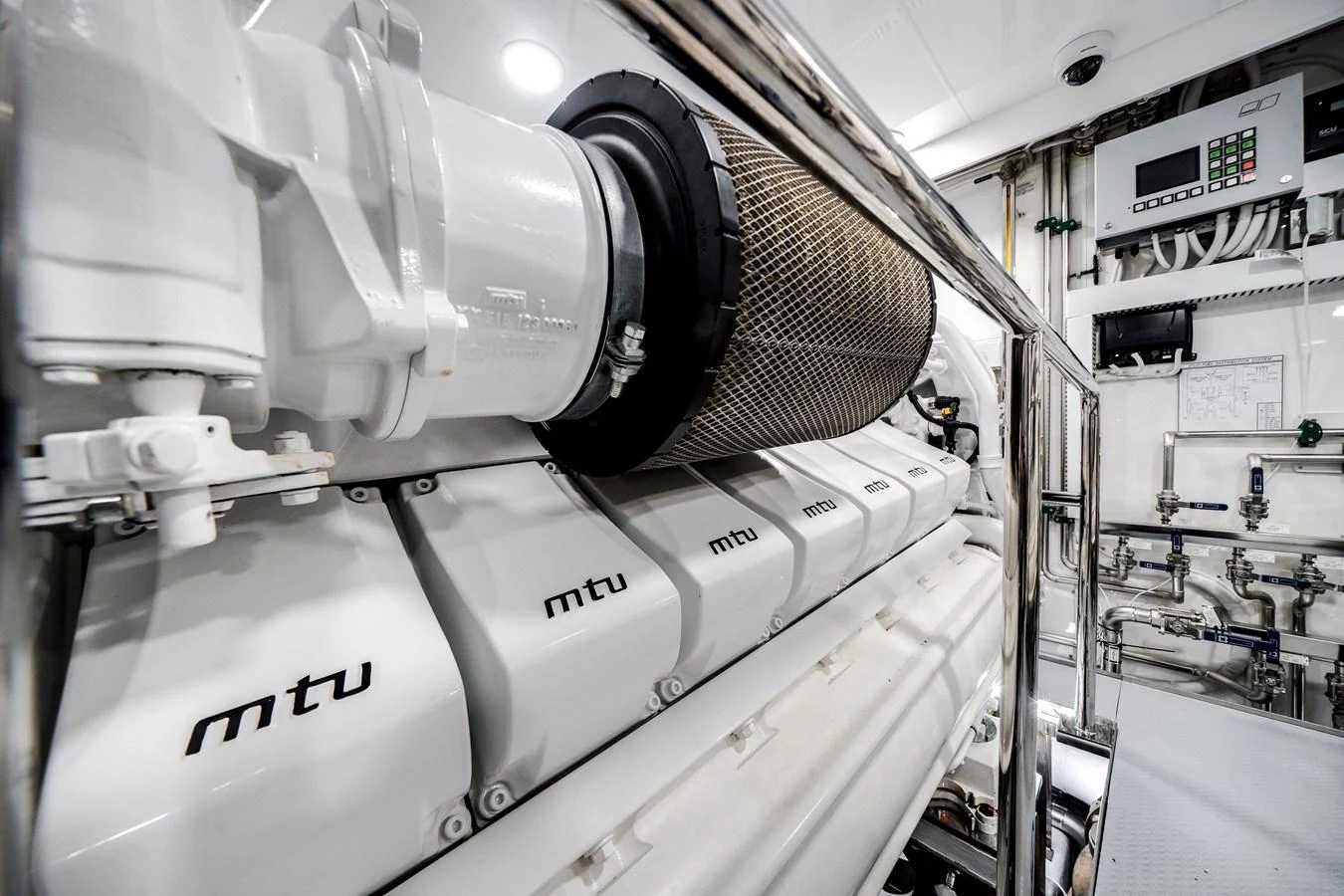 The image showcases the pristine engine room with high-performance MTU engines. aboard OCEAN ALEXANDER 37L/01 Yacht for Sale