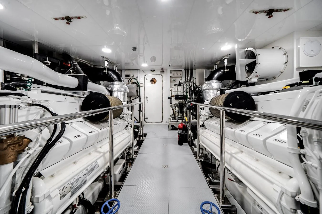 The image showcases a pristine and well-organized engine room with advanced machinery and equipment. aboard OCEAN ALEXANDER 37L/01 Yacht for Sale
