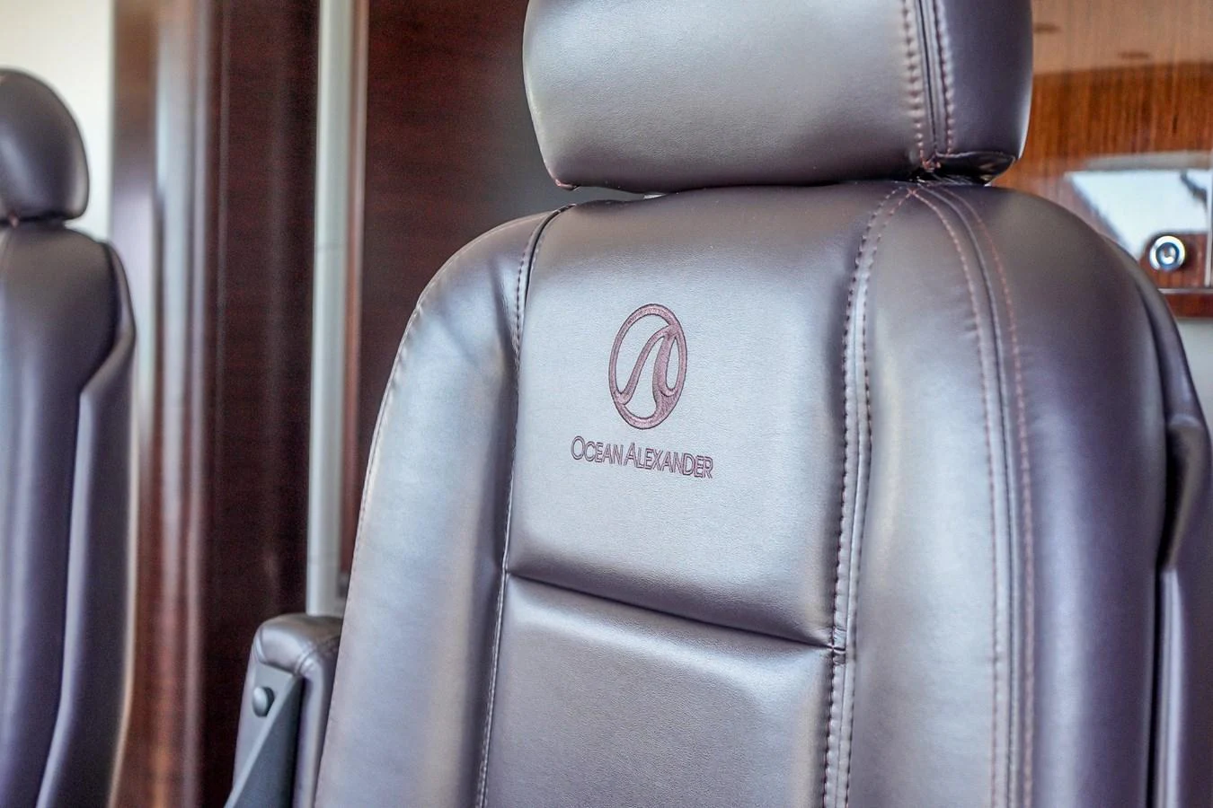 Luxurious leather seating with branded embroidery enhances the yacht's interior elegance. aboard OCEAN ALEXANDER 37L/01 Yacht for Sale