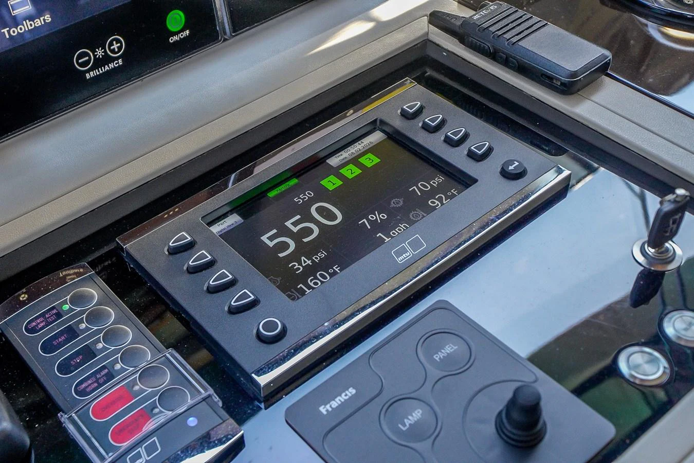 A close-up view of the yacht's helm control panel showcasing advanced navigation and communication equipment. aboard OCEAN ALEXANDER 37L/01 Yacht for Sale