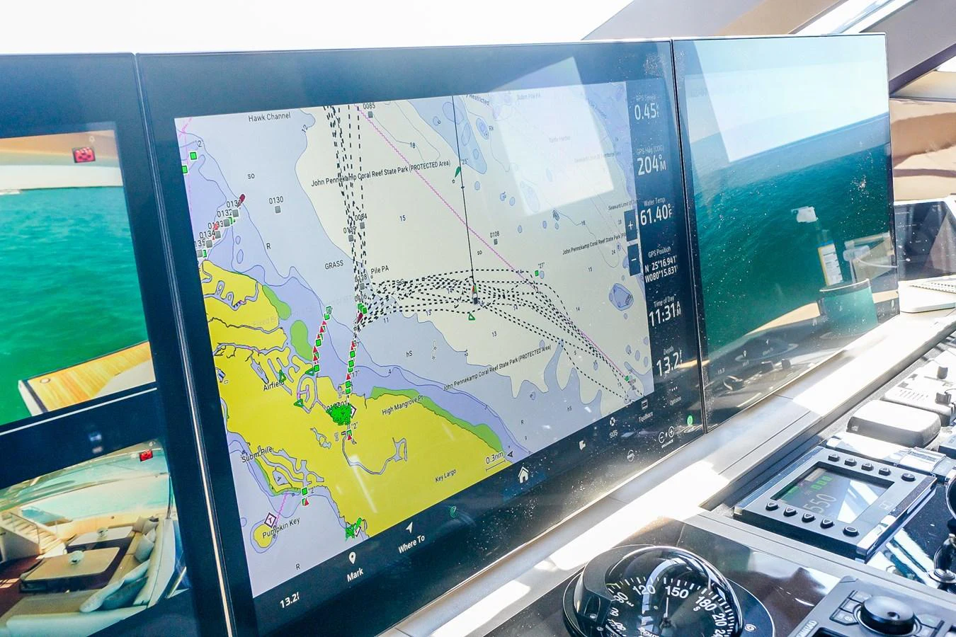 The helm features advanced navigation screens displaying detailed marine charts. aboard OCEAN ALEXANDER 37L/01 Yacht for Sale