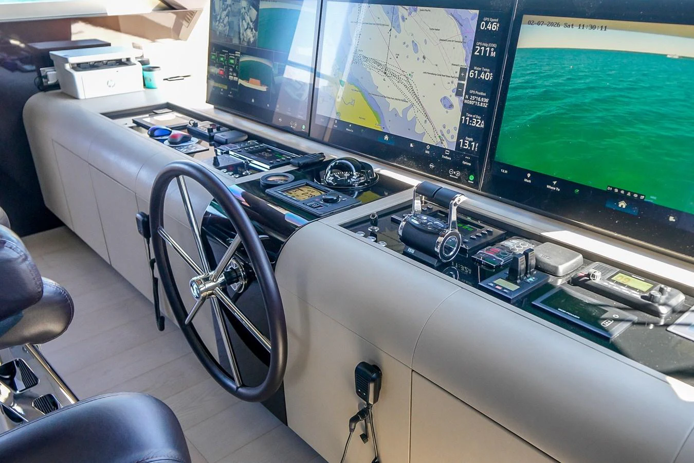 The helm station features advanced navigation equipment and a sleek steering wheel. aboard OCEAN ALEXANDER 37L/01 Yacht for Sale
