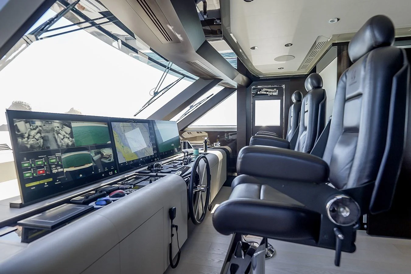The helm station features advanced navigation equipment and luxurious seating. aboard OCEAN ALEXANDER 37L/01 Yacht for Sale