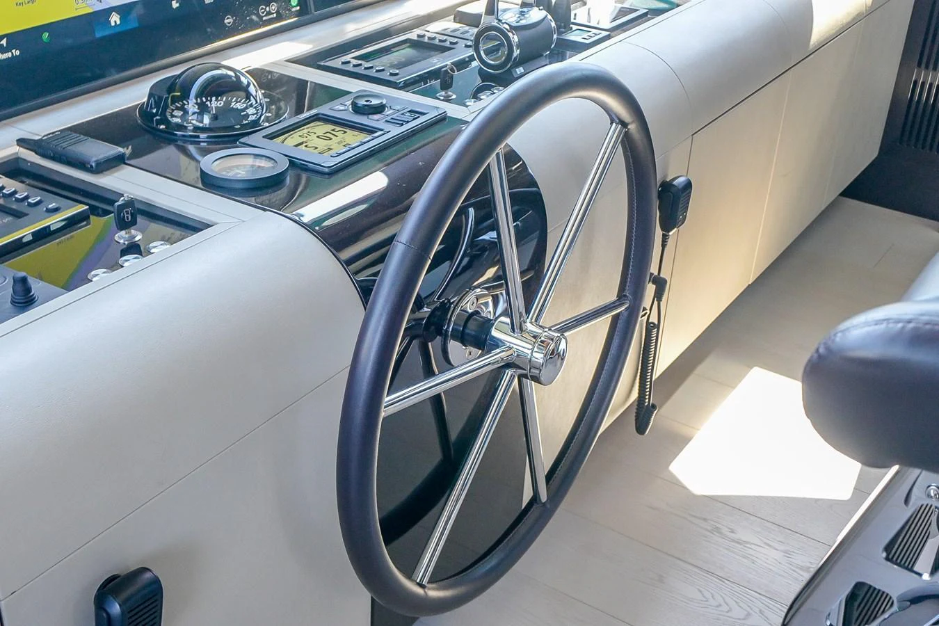 The helm station features a sleek steering wheel and advanced navigation instruments. aboard OCEAN ALEXANDER 37L/01 Yacht for Sale