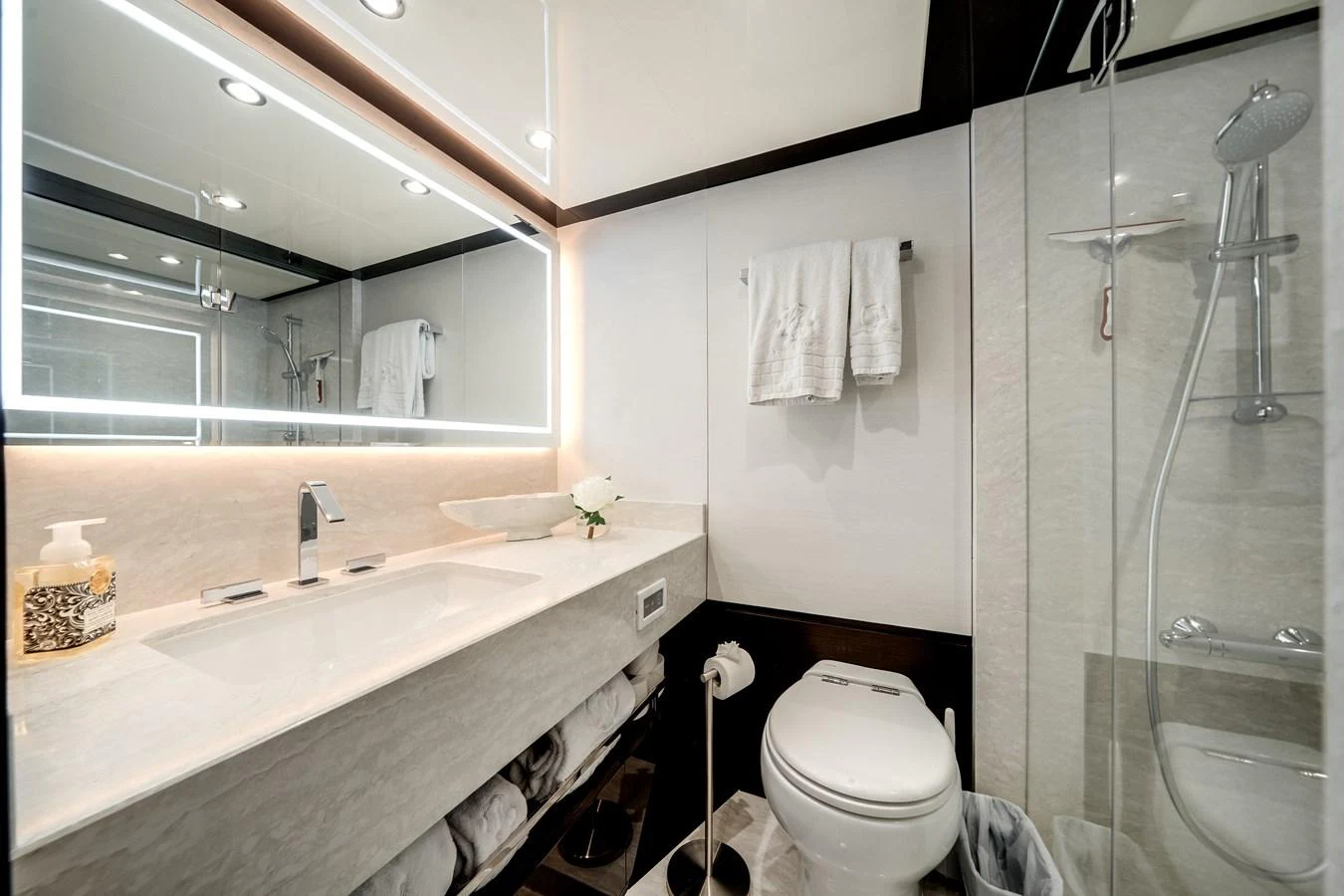 A modern and well-lit bathroom with sleek fixtures and a spacious shower area. aboard OCEAN ALEXANDER 37L/01 Yacht for Sale