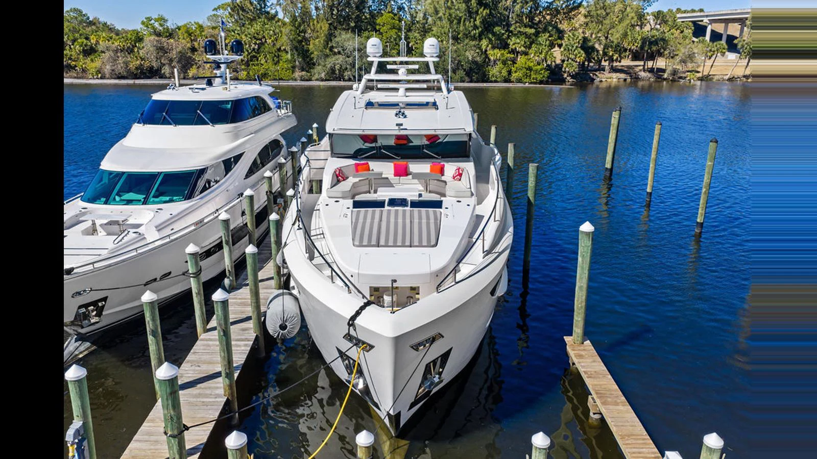 a group of boats are parked in a harbor aboard MOBILLITY Yacht for Sale