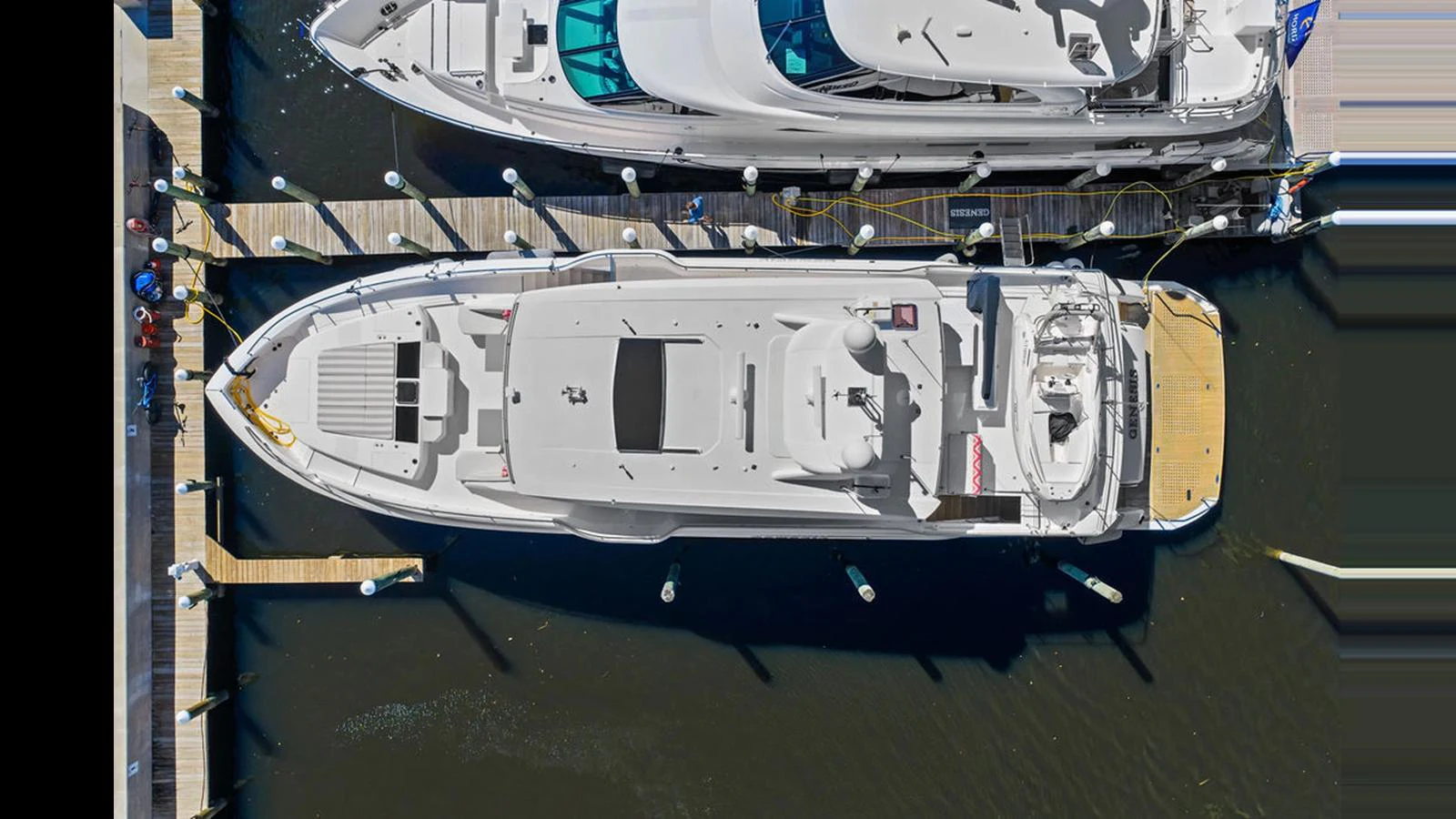 a white and black vehicle aboard MOBILLITY Yacht for Sale