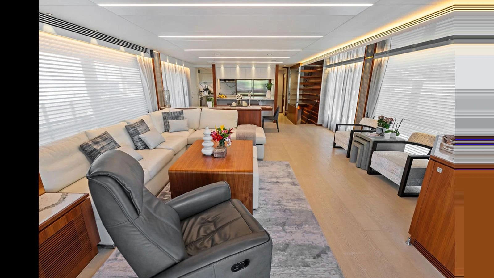 a living room with a couch and a coffee table aboard MOBILLITY Yacht for Sale