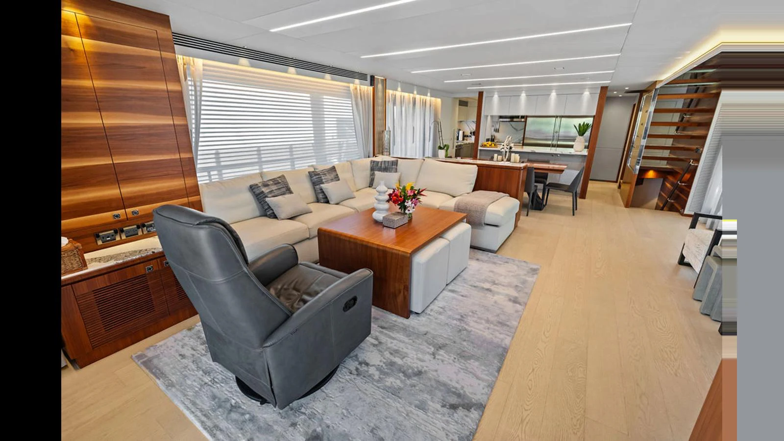 a living room with a couch and a coffee table aboard MOBILLITY Yacht for Sale
