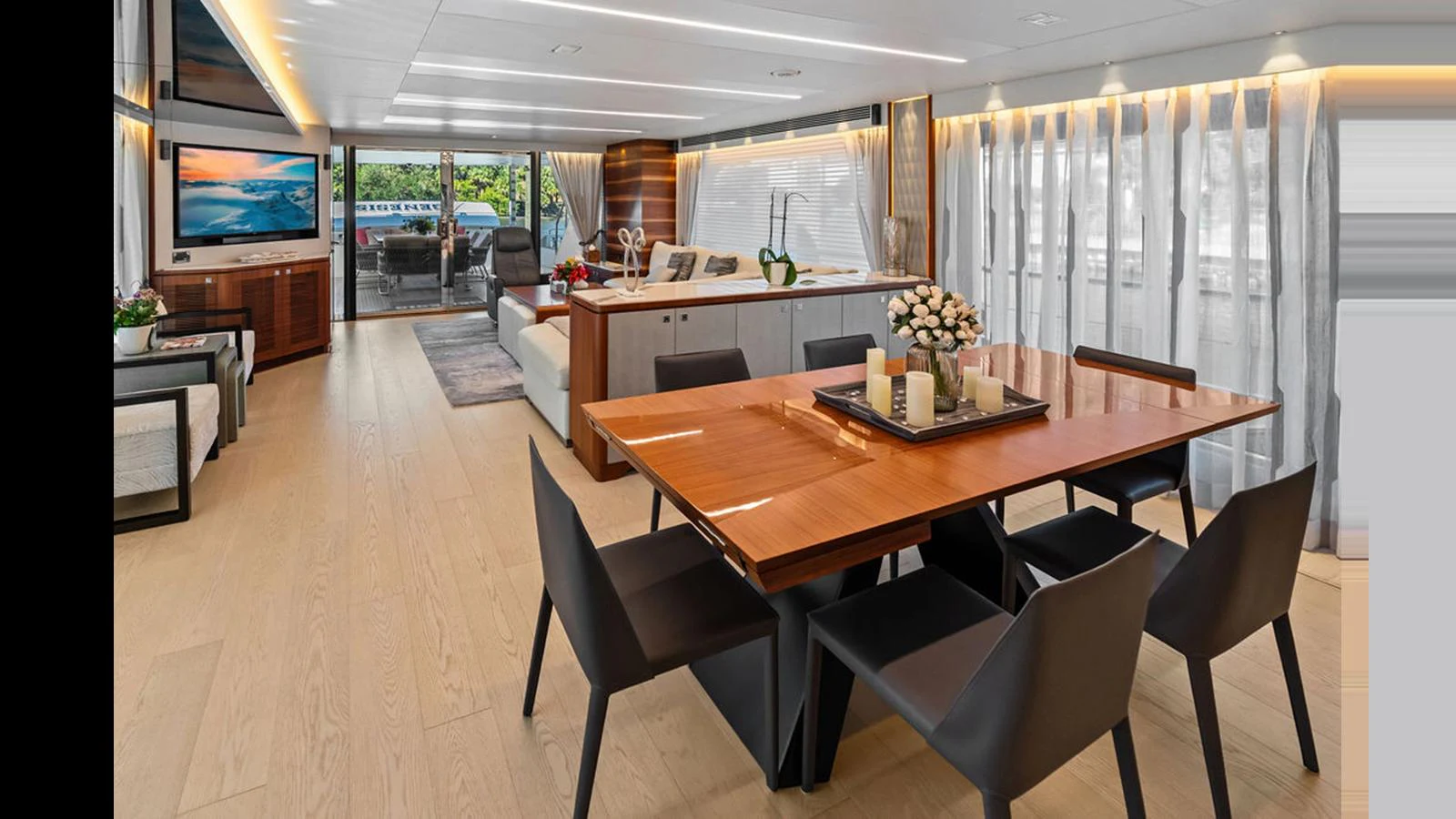 a large conference room with a table and chairs aboard MOBILLITY Yacht for Sale