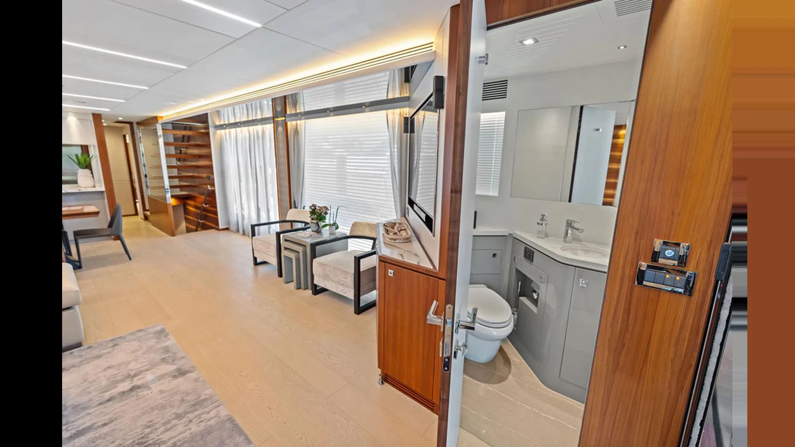 a bathroom with a toilet and a sink aboard MOBILLITY Yacht for Sale