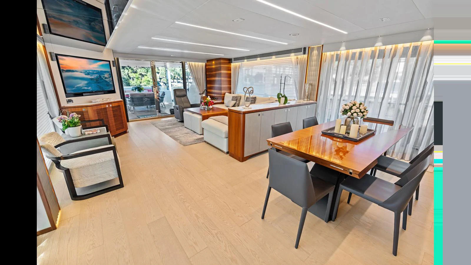 a room with a table and chairs aboard MOBILLITY Yacht for Sale