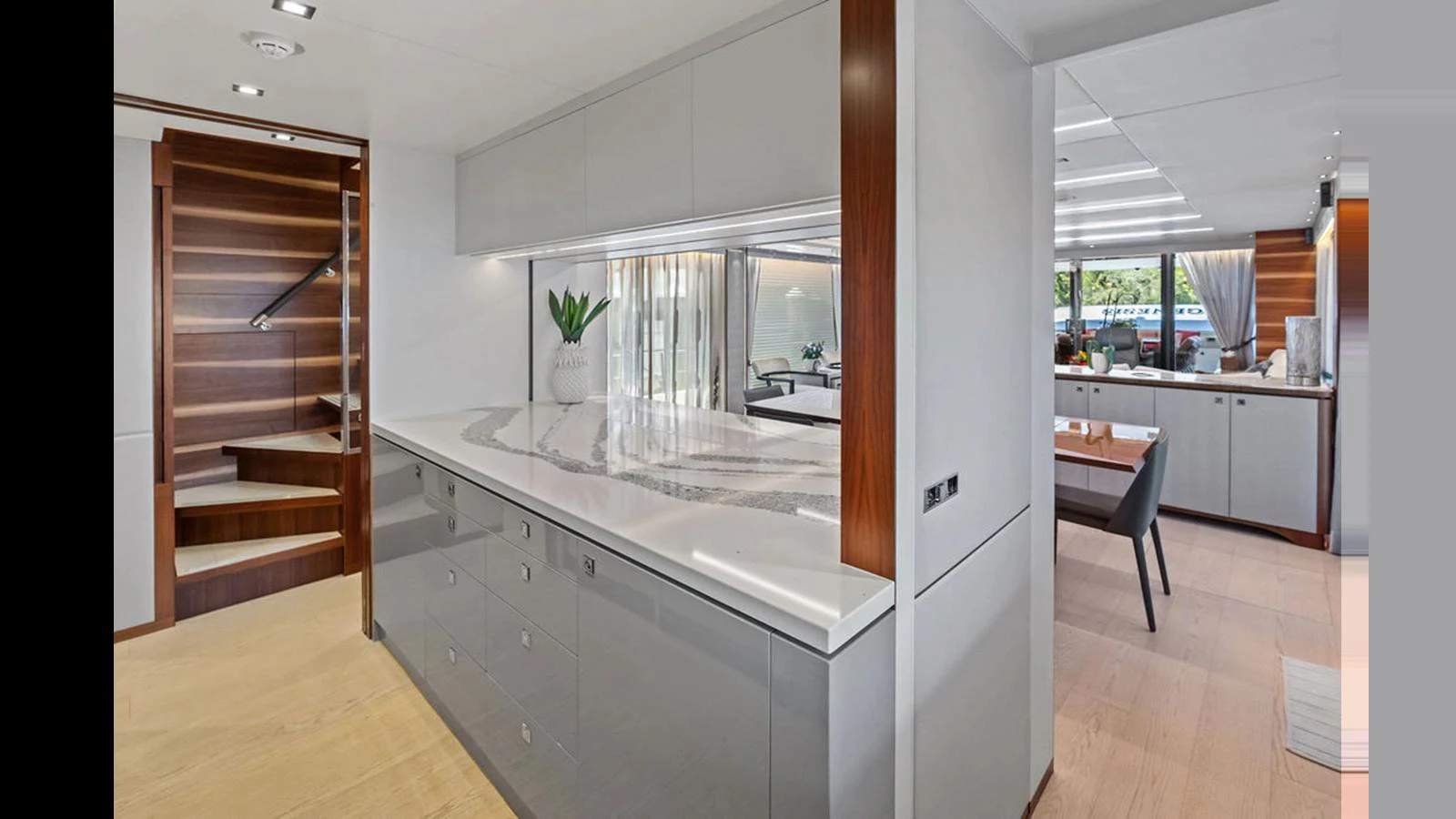 a kitchen with a large window aboard MOBILLITY Yacht for Sale
