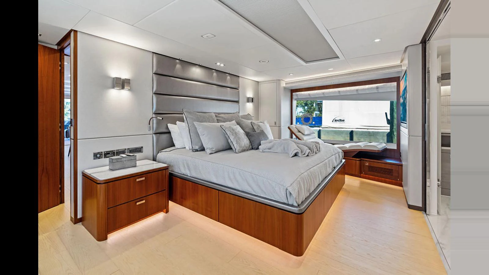 a bedroom with a large bed aboard MOBILLITY Yacht for Sale