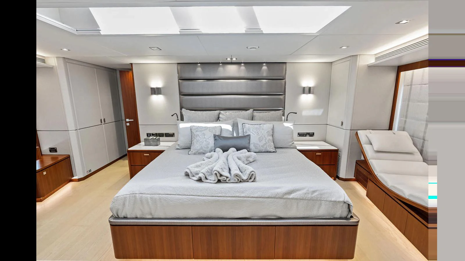 a large bedroom with a bed aboard MOBILLITY Yacht for Sale