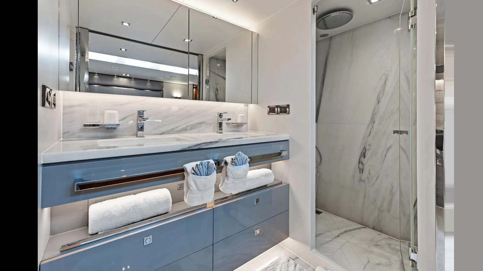 a bathroom with a sink and a mirror aboard MOBILLITY Yacht for Sale
