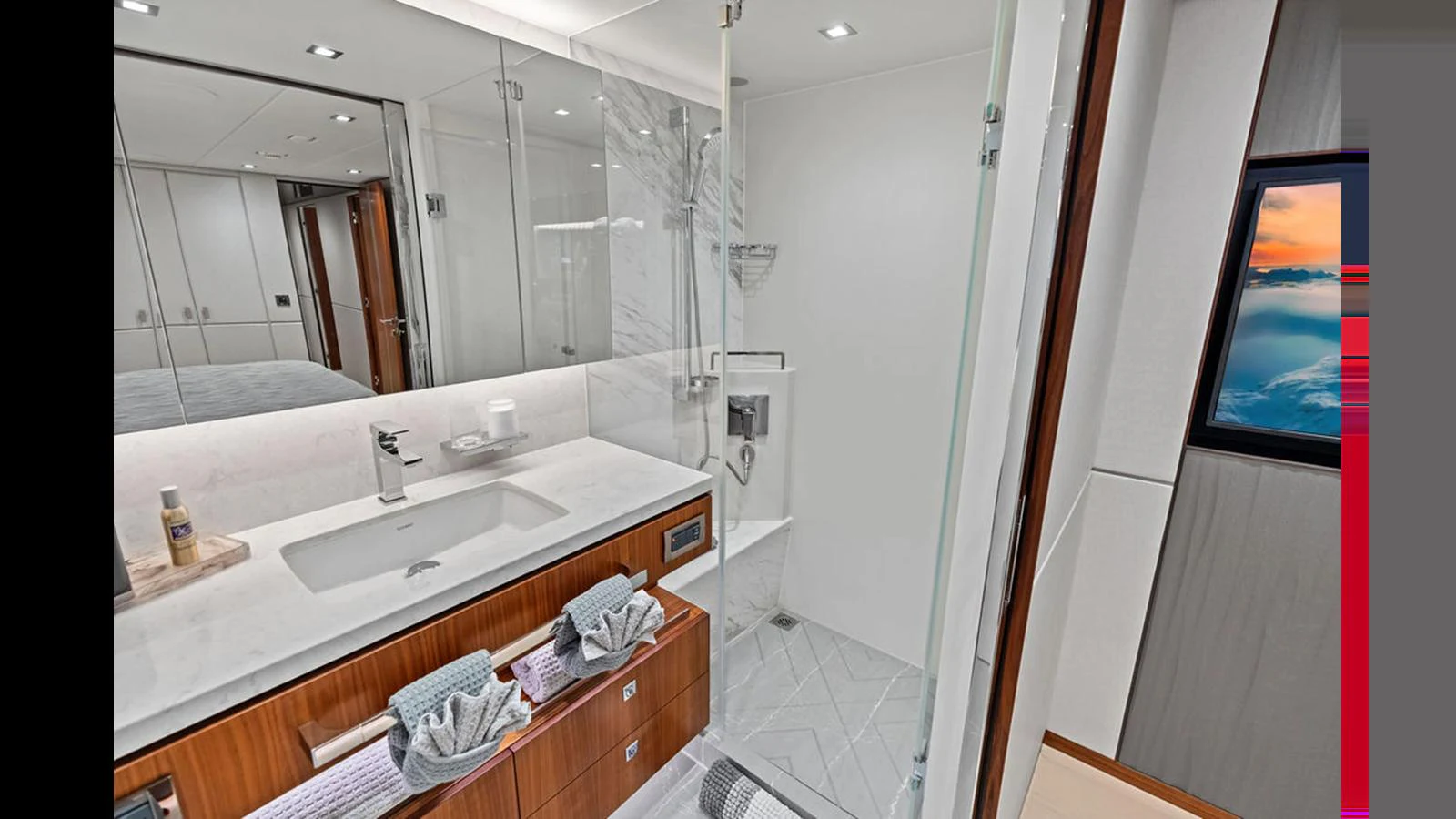 a bathroom with a sink and a mirror aboard MOBILLITY Yacht for Sale