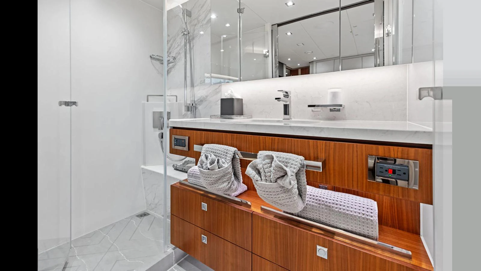a bathroom with a large mirror aboard MOBILLITY Yacht for Sale