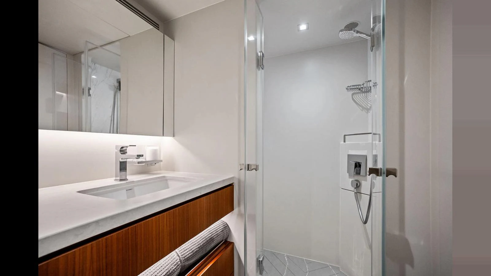 a bathroom with a sink and a mirror aboard MOBILLITY Yacht for Sale