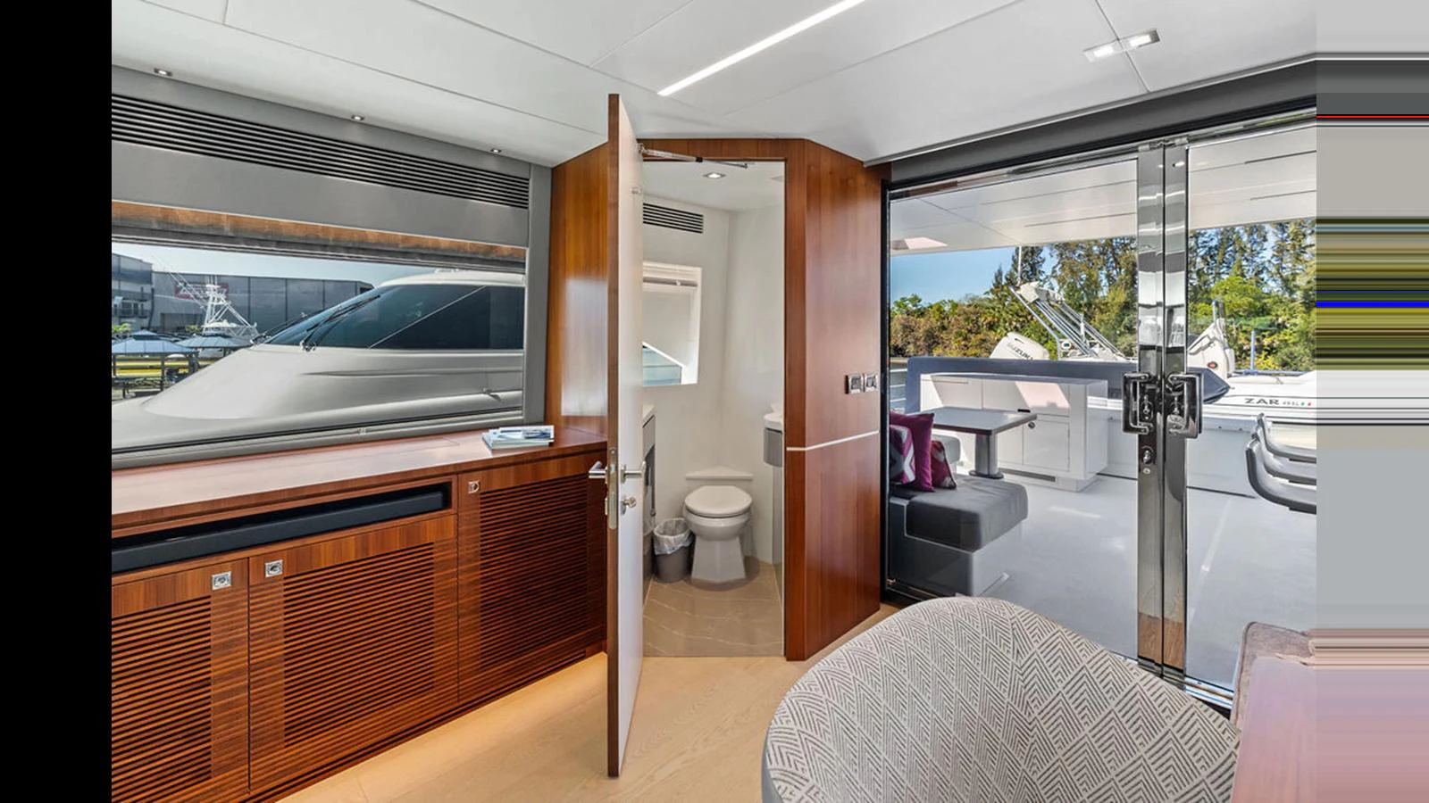 a room with a large window and a toilet aboard MOBILLITY Yacht for Sale