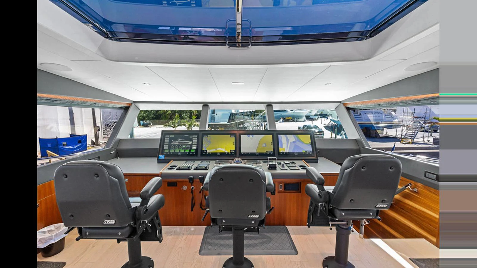 a room with a table and chairs aboard MOBILLITY Yacht for Sale