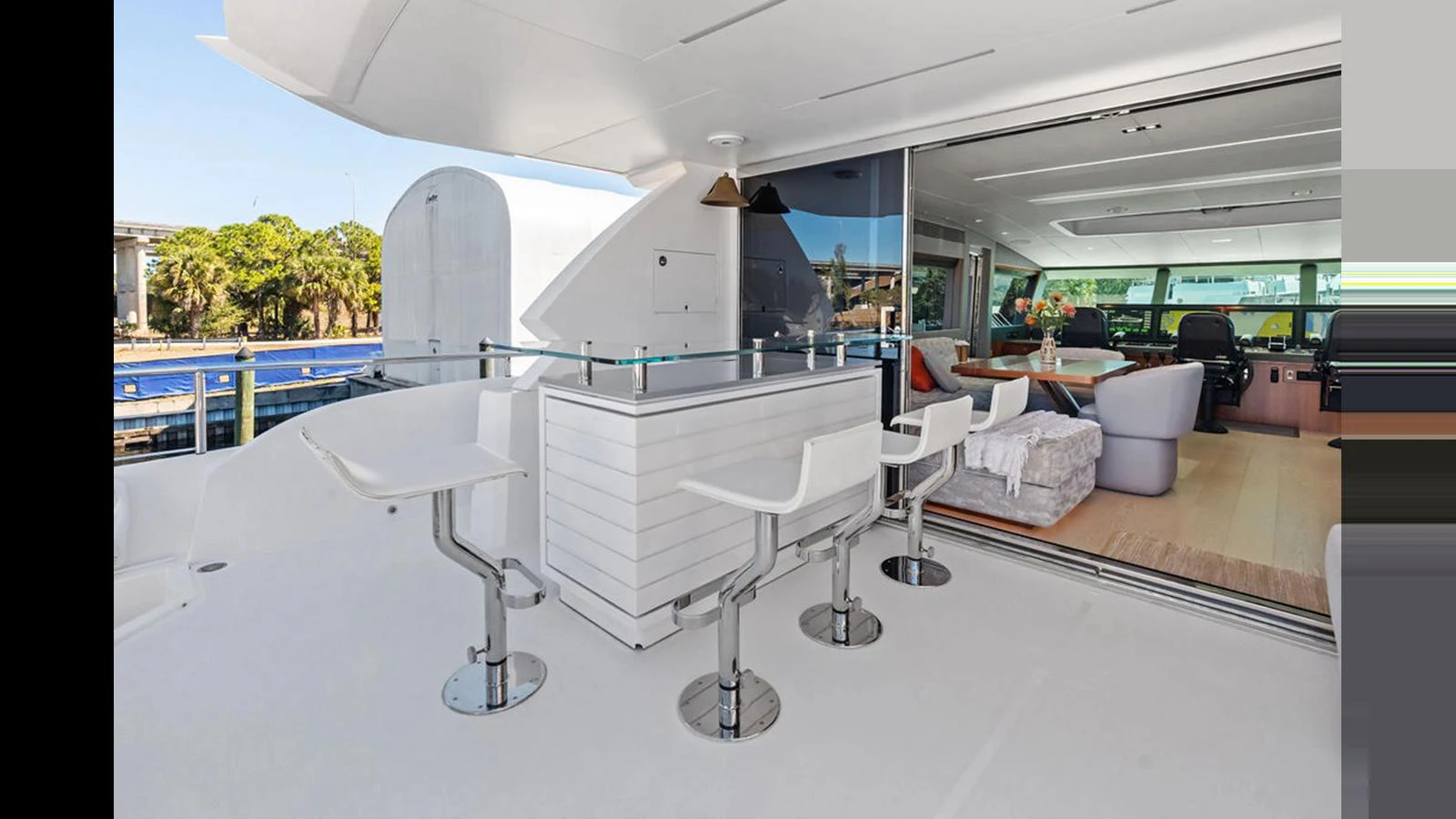 a room with tables and chairs aboard MOBILLITY Yacht for Sale