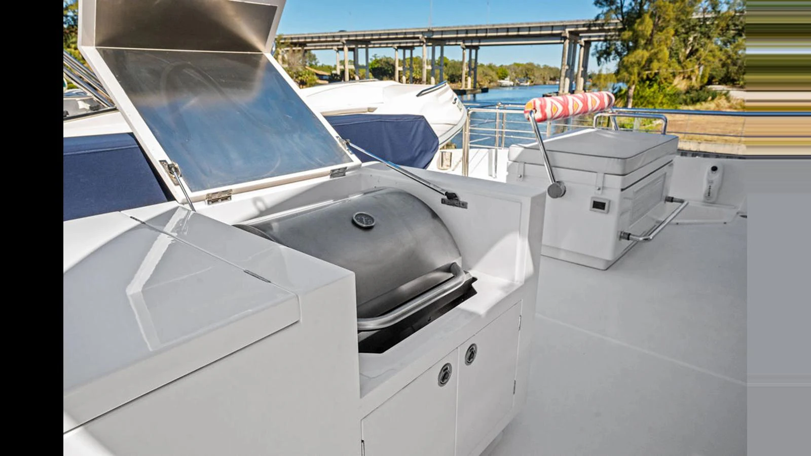 a white boat with a red bow aboard MOBILLITY Yacht for Sale