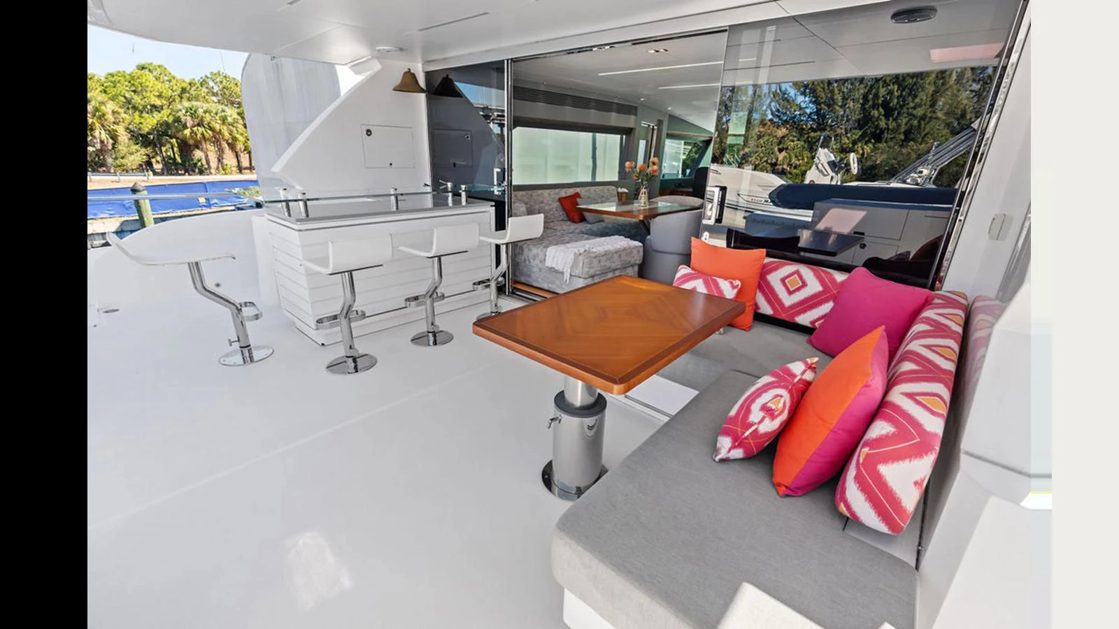 a room with a couch and a table and chairs aboard MOBILLITY Yacht for Sale