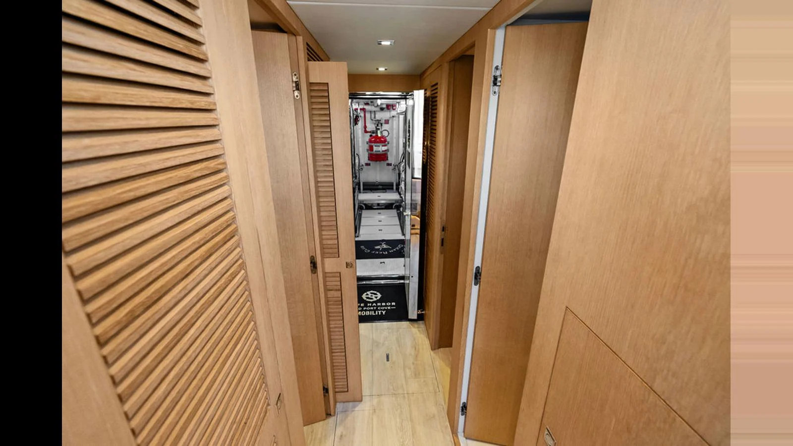 a hallway with doors aboard MOBILLITY Yacht for Sale