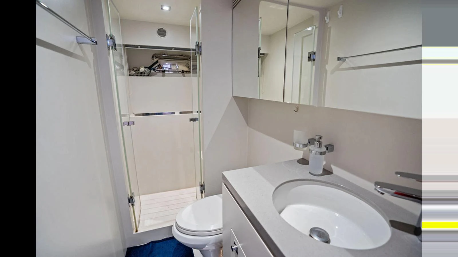 a bathroom with a sink toilet and a shower aboard MOBILLITY Yacht for Sale