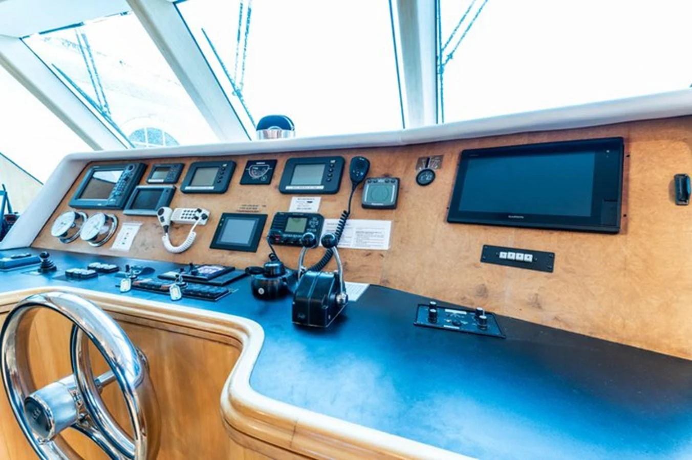 The helm station features advanced navigation equipment and a sleek design. aboard BREAKAWAY Yacht for Sale