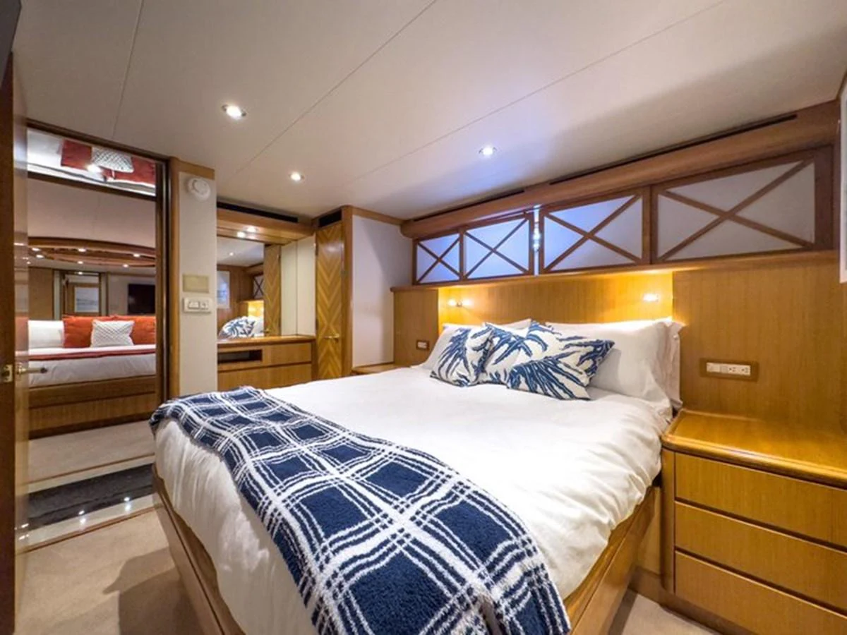 The stateroom features a comfortable bed with stylish bedding and ample storage space. aboard BREAKAWAY Yacht for Sale