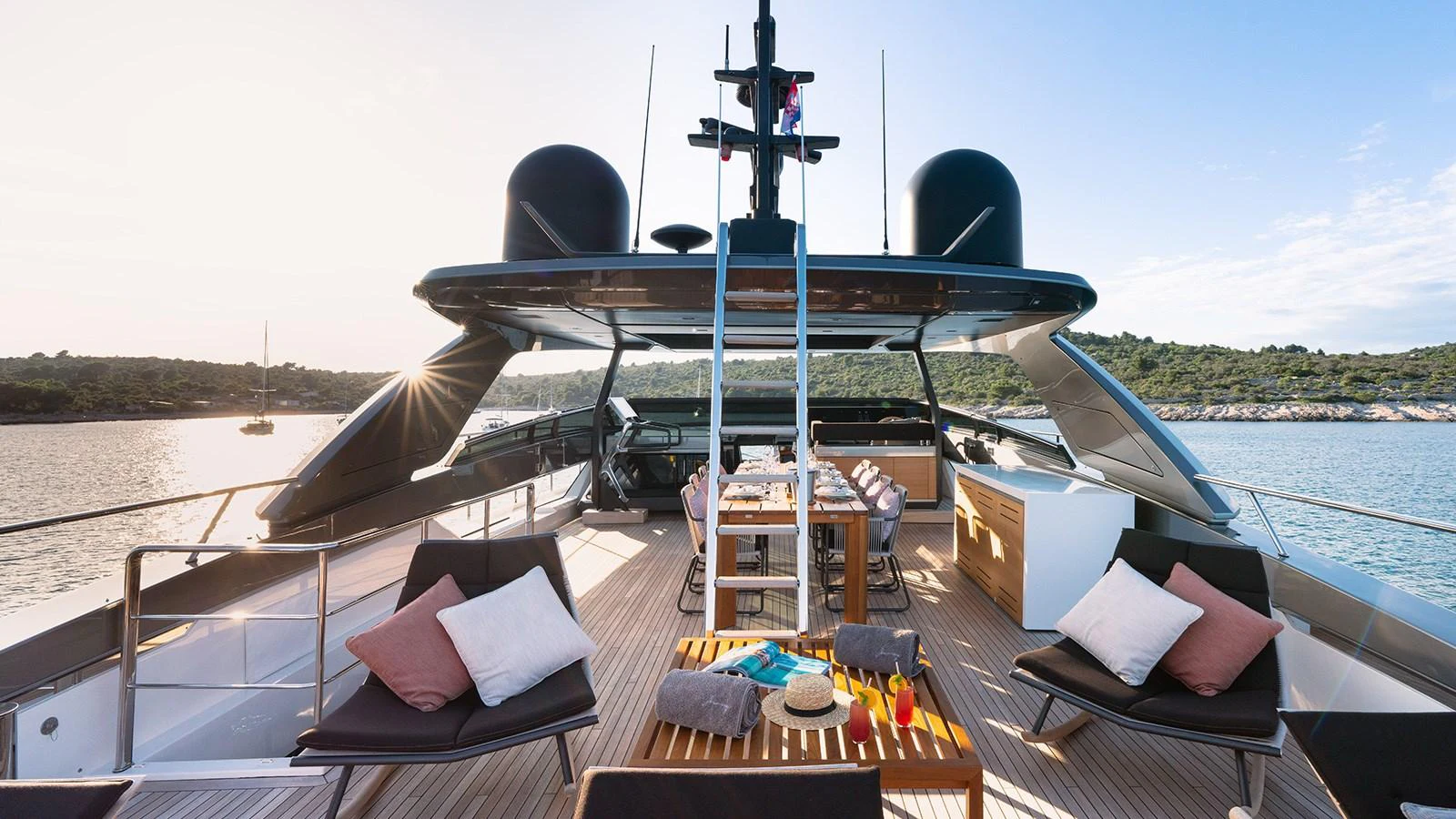 The flybridge offers a spacious and luxurious outdoor dining and lounging area with stunning views. aboard JOURNEY Yacht for Sale