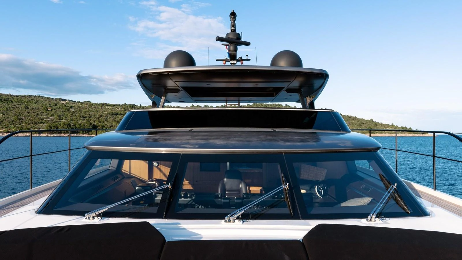 The yacht's sleek exterior showcases modern design elements against a serene ocean backdrop. aboard JOURNEY Yacht for Sale