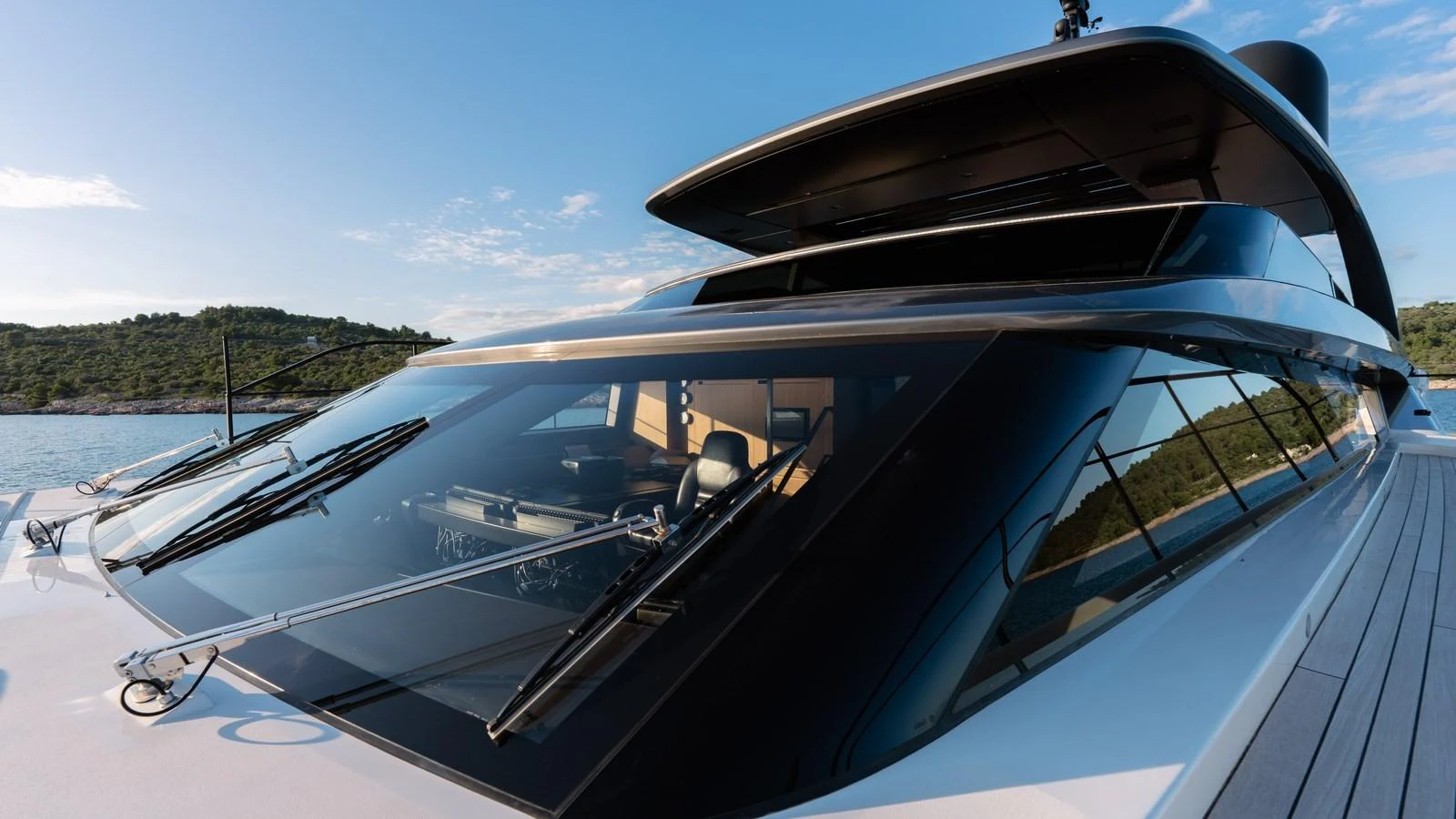 The sleek and modern exterior of the yacht showcases its sophisticated design and expansive windows. aboard JOURNEY Yacht for Sale
