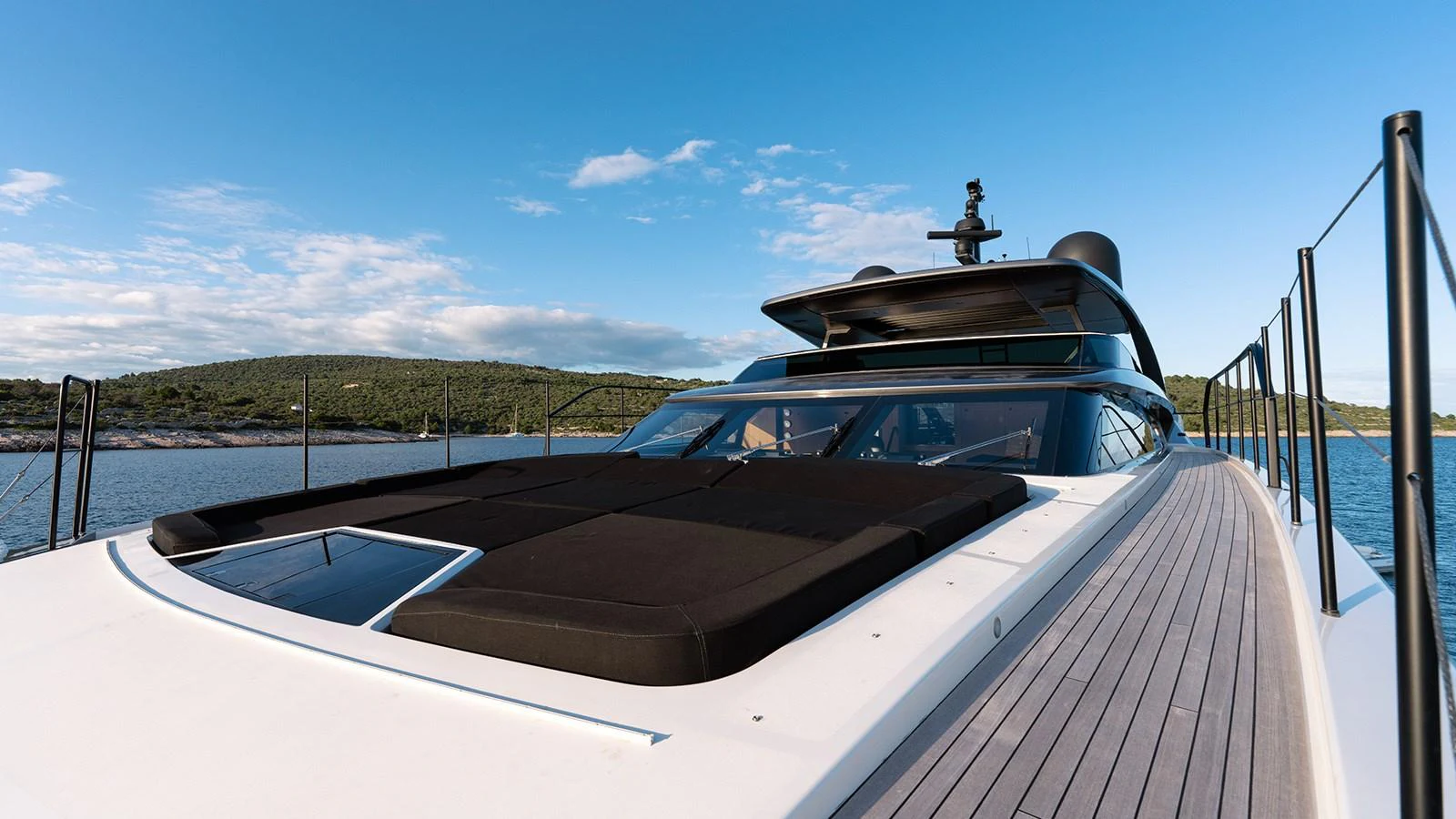 The yacht's sleek exterior features a spacious sunbathing area on the foredeck, perfect for relaxation. aboard JOURNEY Yacht for Sale