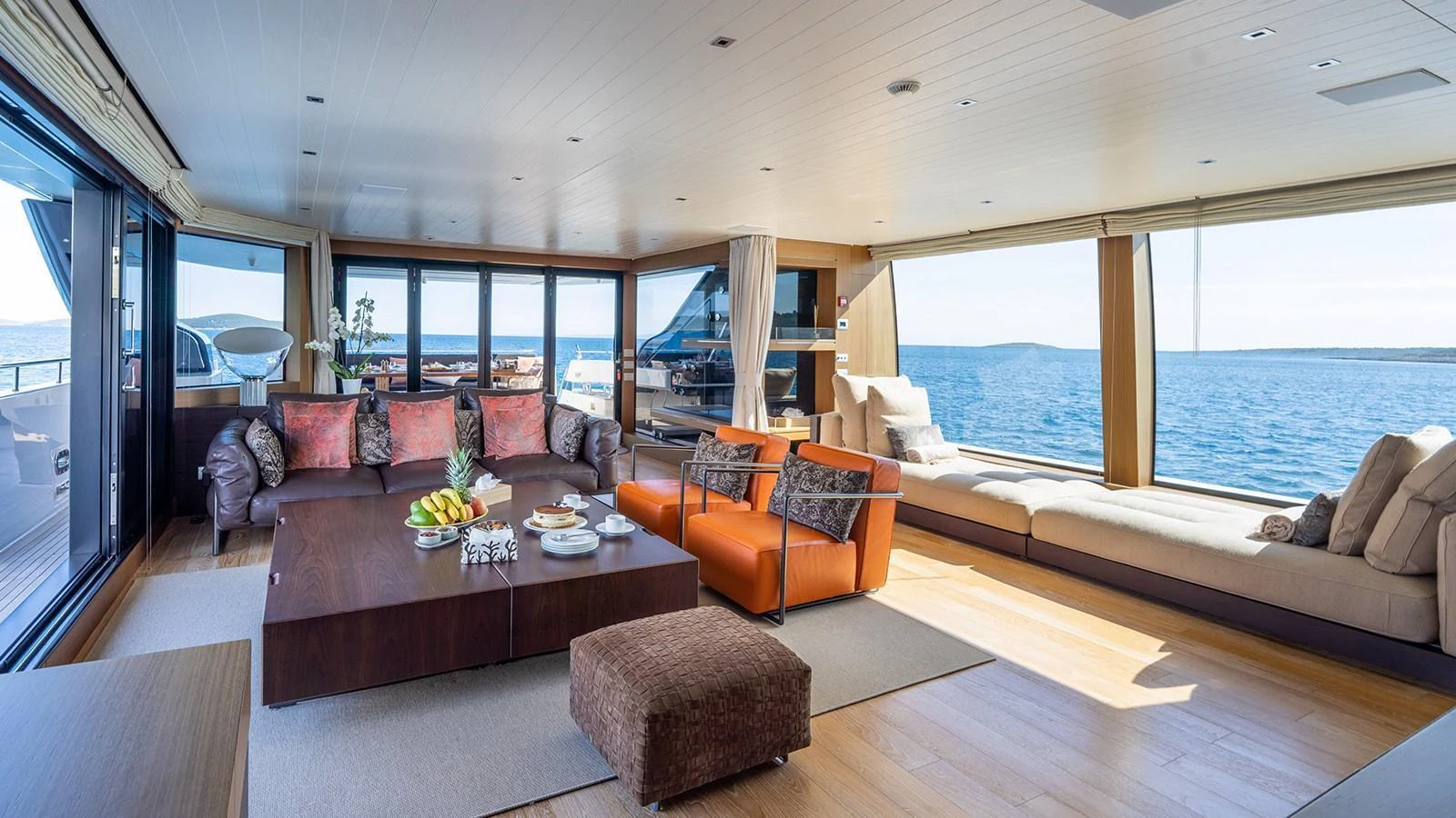 The spacious salon offers panoramic views and luxurious seating arrangements. aboard JOURNEY Yacht for Sale