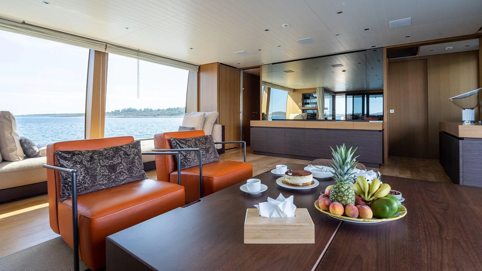 The salon features a spacious and inviting seating area with a view of the water. aboard JOURNEY Yacht for Sale